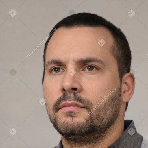 Neutral white young-adult male with short  black hair and brown eyes