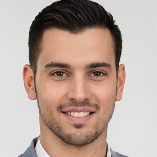 Joyful white young-adult male with short  brown hair and brown eyes