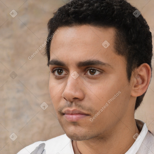 Neutral white young-adult male with short  black hair and brown eyes