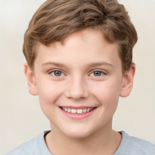 Joyful white child male with short  brown hair and grey eyes