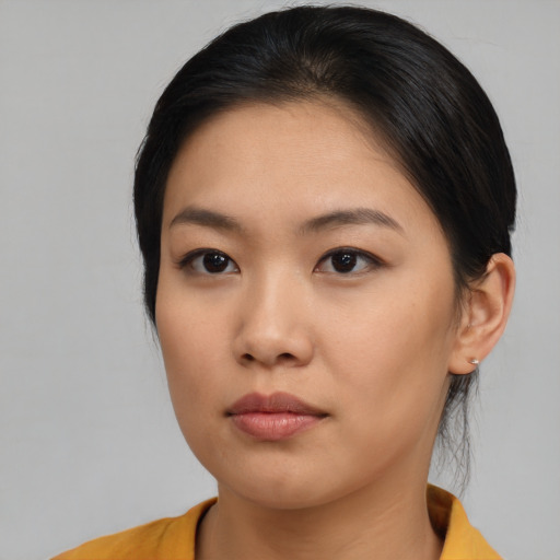 Neutral asian young-adult female with medium  brown hair and brown eyes