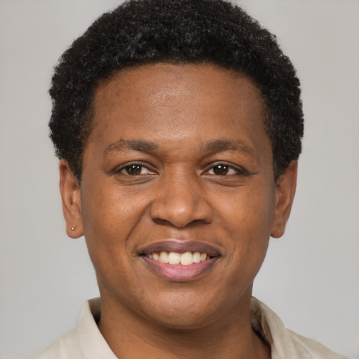 Joyful latino young-adult male with short  brown hair and brown eyes