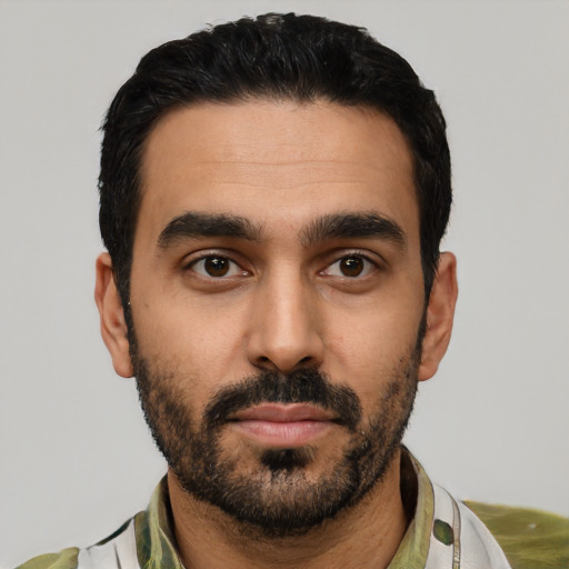 Neutral latino young-adult male with short  black hair and brown eyes