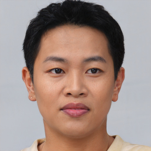 Joyful asian young-adult male with short  brown hair and brown eyes