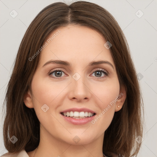 Joyful white young-adult female with medium  brown hair and green eyes