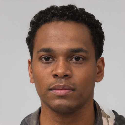 Neutral black young-adult male with short  black hair and brown eyes