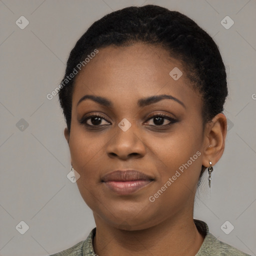 Joyful black young-adult female with short  black hair and brown eyes