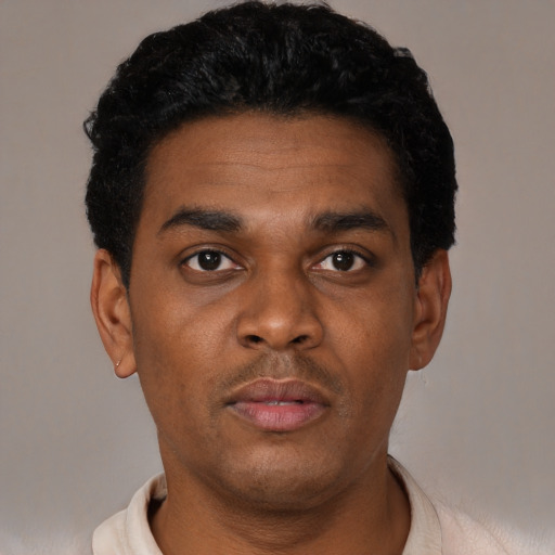 Neutral black young-adult male with short  black hair and brown eyes