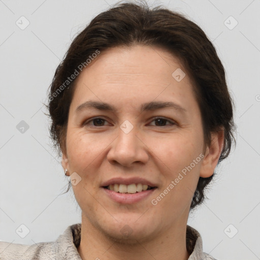 Joyful white adult female with short  brown hair and brown eyes