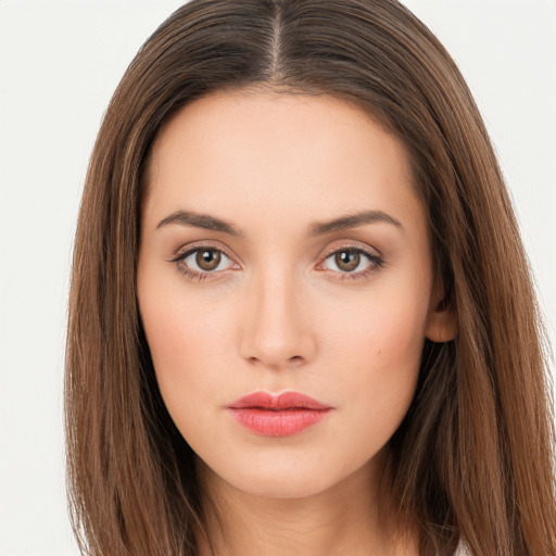 Neutral white young-adult female with long  brown hair and brown eyes