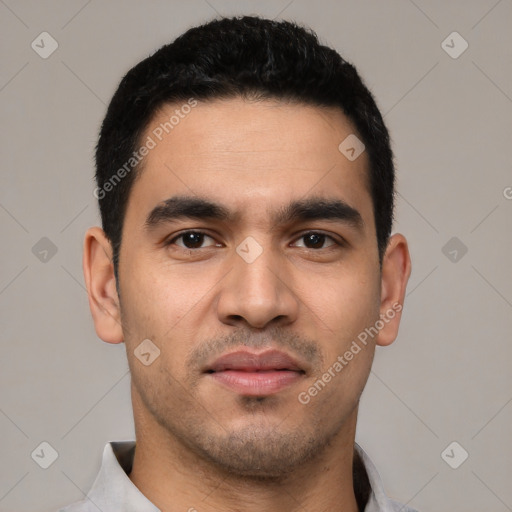 Joyful white young-adult male with short  black hair and brown eyes