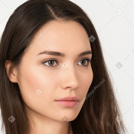 Neutral white young-adult female with long  brown hair and brown eyes