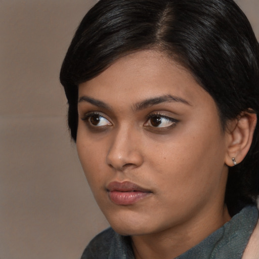 Neutral asian young-adult female with medium  brown hair and brown eyes