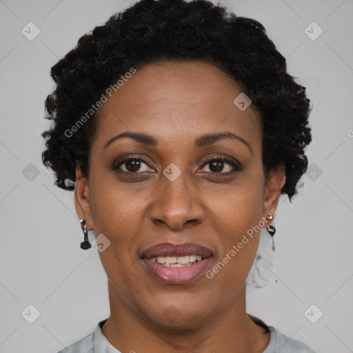 Joyful black adult female with short  brown hair and brown eyes