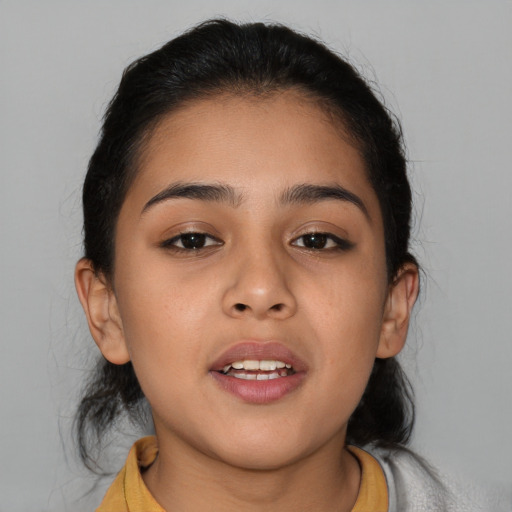 Joyful asian child female with medium  brown hair and brown eyes