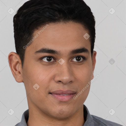 Joyful latino young-adult male with short  brown hair and brown eyes