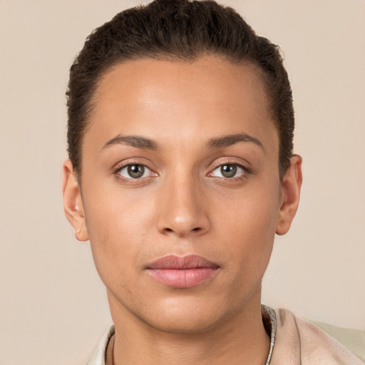 Joyful white young-adult female with short  brown hair and brown eyes