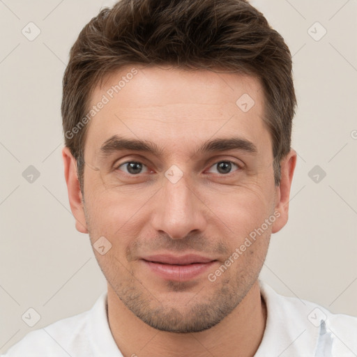 Joyful white young-adult male with short  brown hair and brown eyes