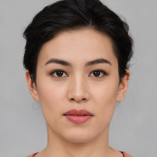 Joyful white young-adult female with medium  black hair and brown eyes