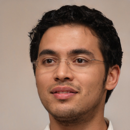 Joyful latino young-adult male with short  black hair and brown eyes