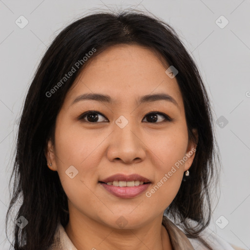 Joyful latino young-adult female with medium  brown hair and brown eyes