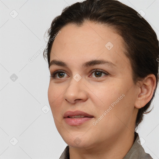 Joyful white young-adult female with short  brown hair and brown eyes