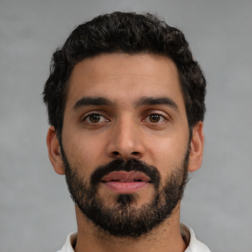 Neutral latino young-adult male with short  black hair and brown eyes