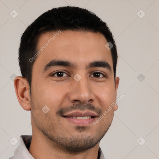 Joyful latino young-adult male with short  black hair and brown eyes