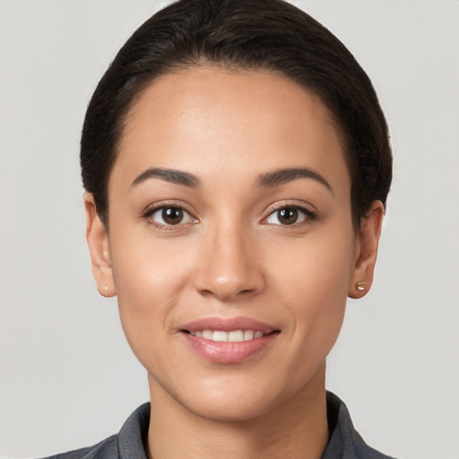 Joyful white young-adult female with short  brown hair and brown eyes