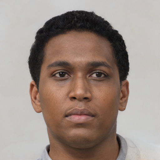 Neutral black young-adult male with short  black hair and brown eyes