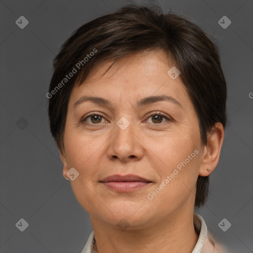 Joyful white adult female with short  brown hair and brown eyes