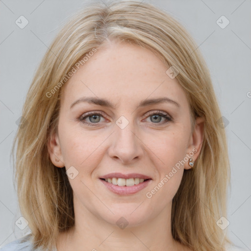 Joyful white young-adult female with medium  brown hair and blue eyes