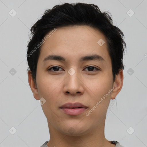 Joyful latino young-adult male with short  brown hair and brown eyes