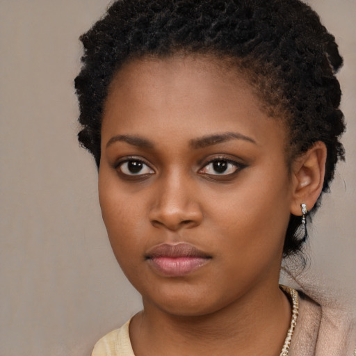 Neutral black young-adult female with short  brown hair and brown eyes