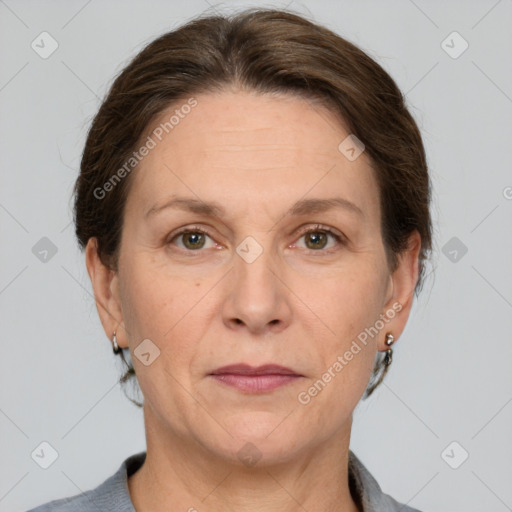 Joyful white adult female with short  brown hair and grey eyes