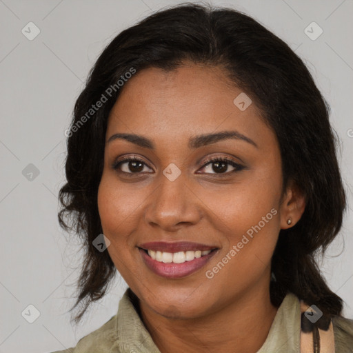 Joyful black young-adult female with medium  brown hair and brown eyes