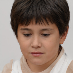 Joyful white child female with short  brown hair and brown eyes