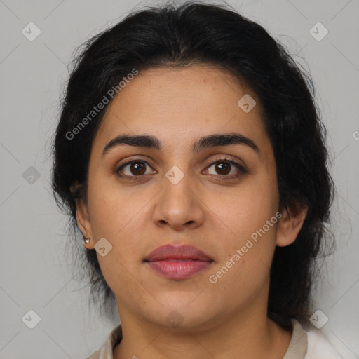 Joyful latino young-adult female with medium  brown hair and brown eyes