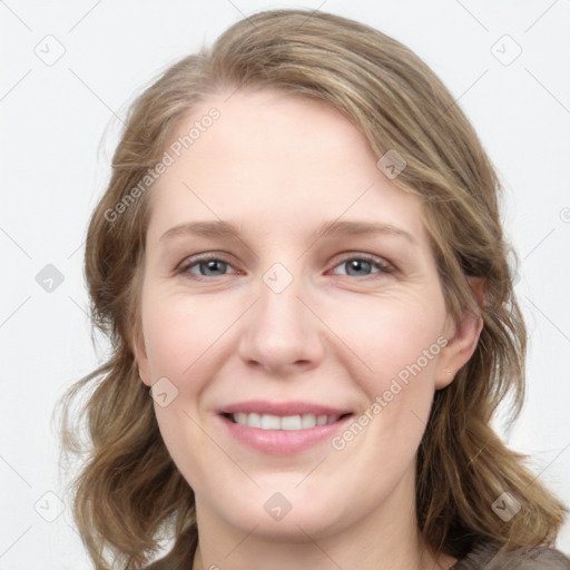 Joyful white young-adult female with medium  brown hair and blue eyes