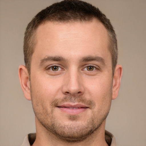 Joyful white young-adult male with short  brown hair and brown eyes