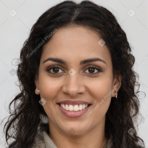 Joyful latino young-adult female with long  brown hair and brown eyes