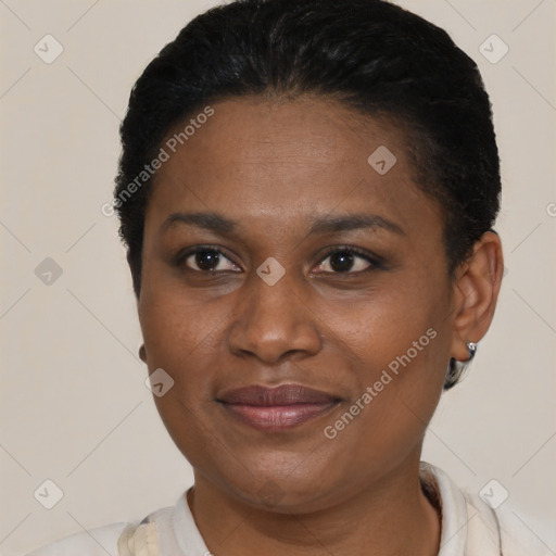 Joyful black adult female with short  brown hair and brown eyes