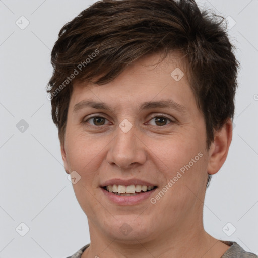 Joyful white young-adult female with short  brown hair and grey eyes