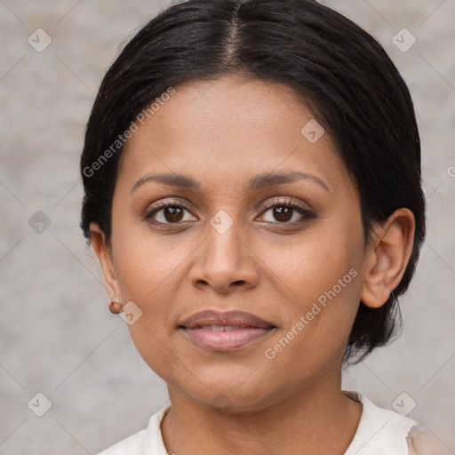 Joyful latino young-adult female with short  brown hair and brown eyes