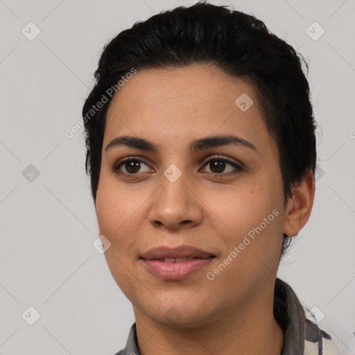 Joyful latino young-adult female with short  black hair and brown eyes