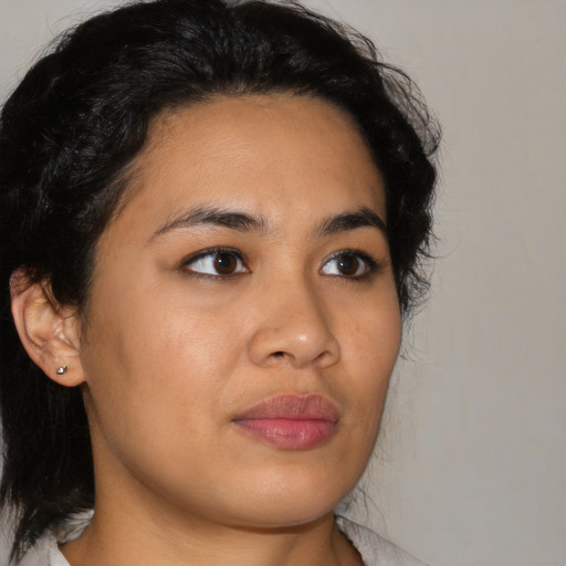 Joyful latino young-adult female with medium  black hair and brown eyes