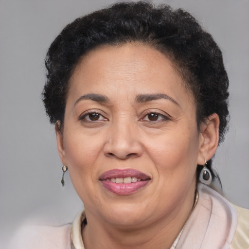 Joyful latino adult female with short  brown hair and brown eyes