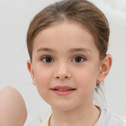 Joyful white child female with short  brown hair and brown eyes