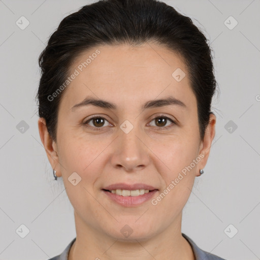 Joyful white adult female with medium  brown hair and brown eyes