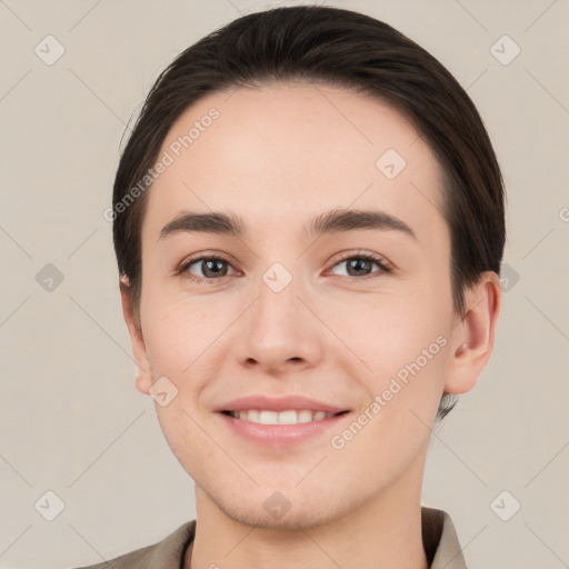 Joyful white young-adult female with short  brown hair and brown eyes